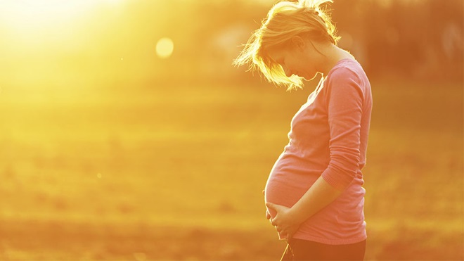 pregnant woman in the sunshine